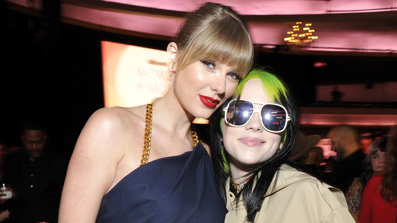 Taylor Swift and Billie Eilish posing for photos