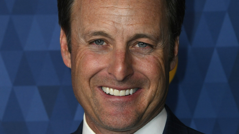 Chris Harrison poses at an event.