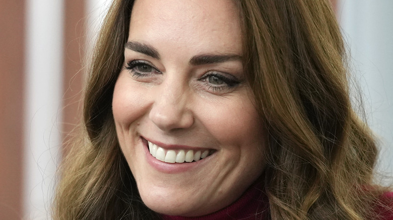 Kate Middleton smiles during an outing