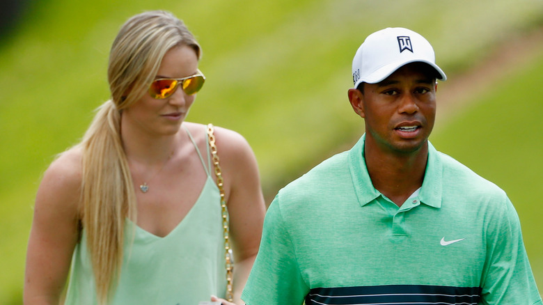 Lindsey Vonn and Tiger Woods on the green at the 2015 Masters Tournament