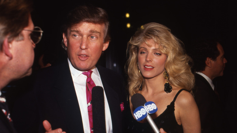 Donald Trump and Marla Maples talking to press