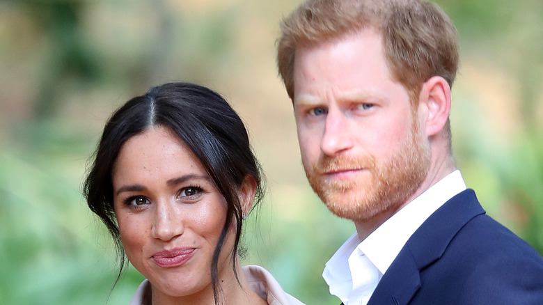 Meghan and Harry smile for photographers