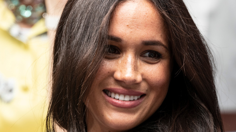 Meghan Markle smiling at camera