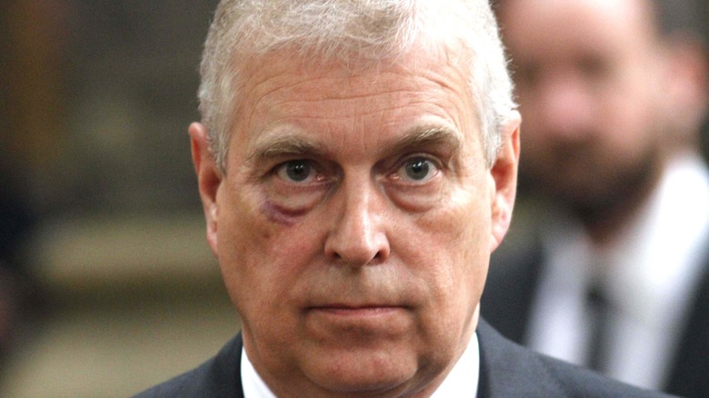 Prince Andrew looks sullen