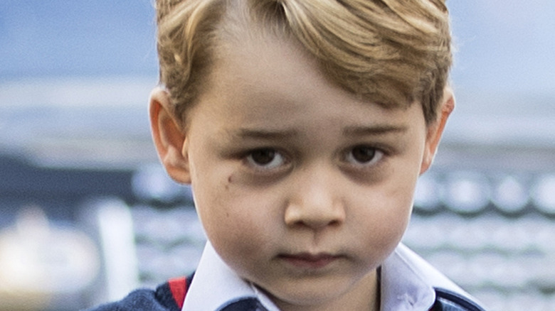 Prince George poses for the camera.