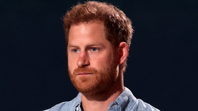 Prince Harry standing at event