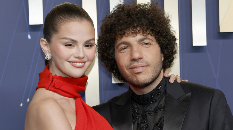 Selena Geomz and Benny Blanco pose for a photo at an event