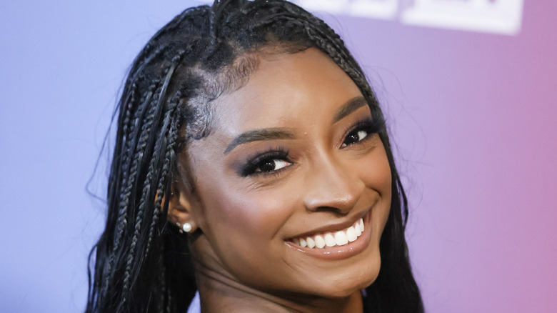 Simone Biles looking over shoulder