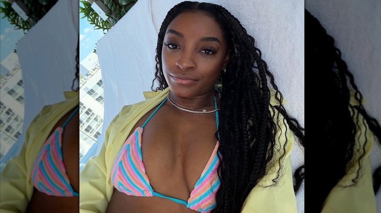 Simone Biles in bikini top outdoors