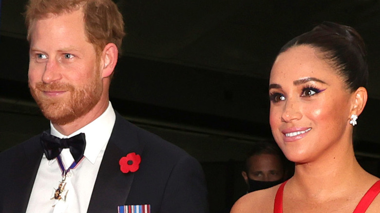 Prince Harry and Meghan Markle smiling