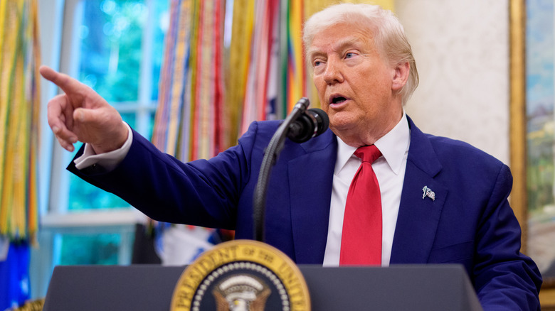 Donald Trump takes questions from reporters in the Oval Office