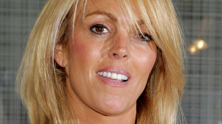 Dina Lohan smiles for the camera