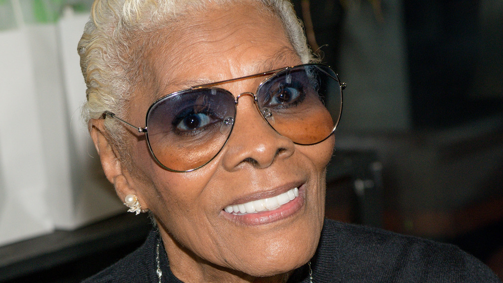 Dionne Warwick smiling in glasses