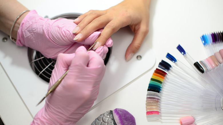 woman getting manicure
