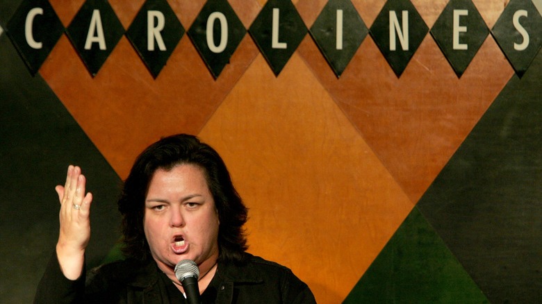 Rosie O'Donnell under a sign for Caroline's, where she came out shortly after 9/11.