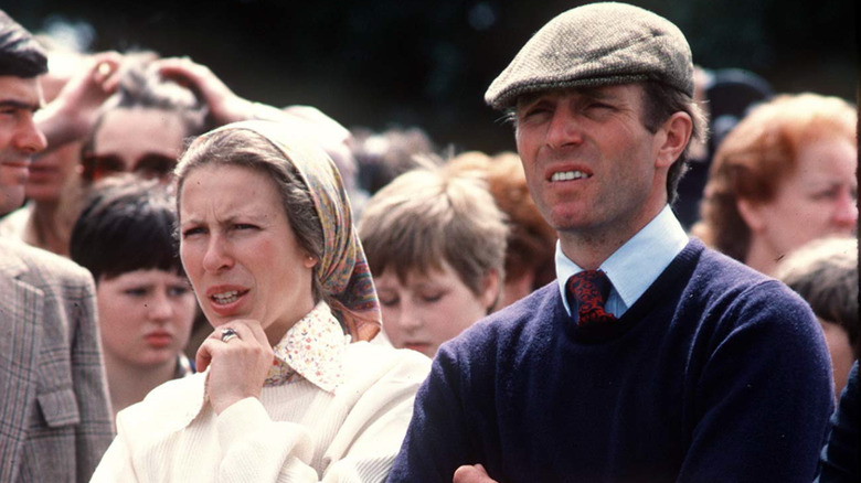 Princess Anne and Mark Phillips looking at something together