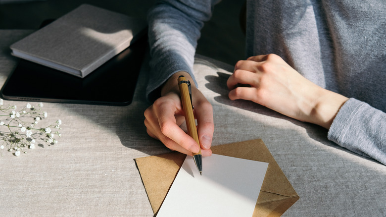 Person creating a wedding invitation