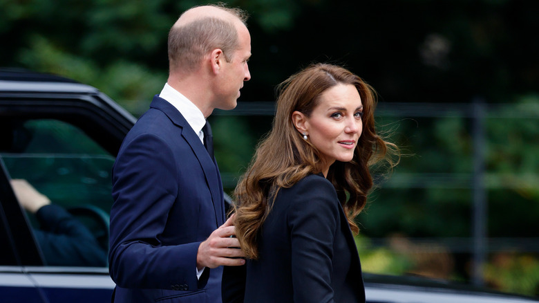 Prince William with hand on Kate Middleton's back