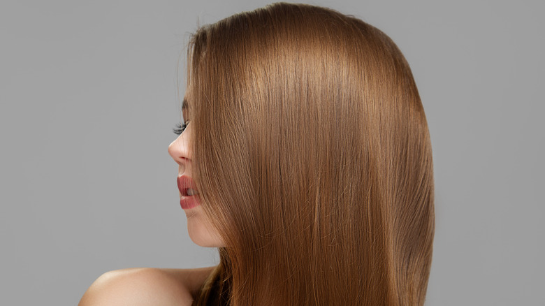 Woman with vibrant hair looking to side