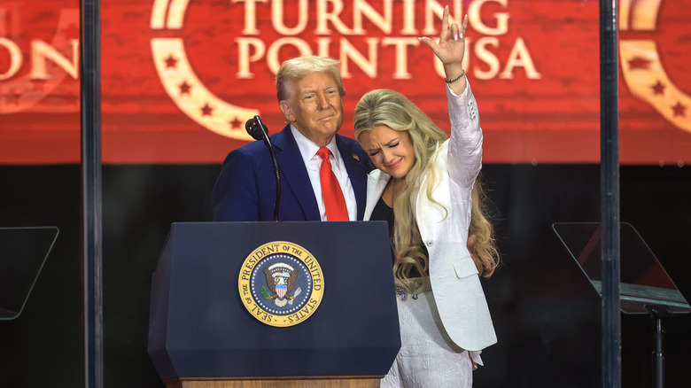 Donald Trump standing next to Erika Trump at Charlie Kirk's memorial service