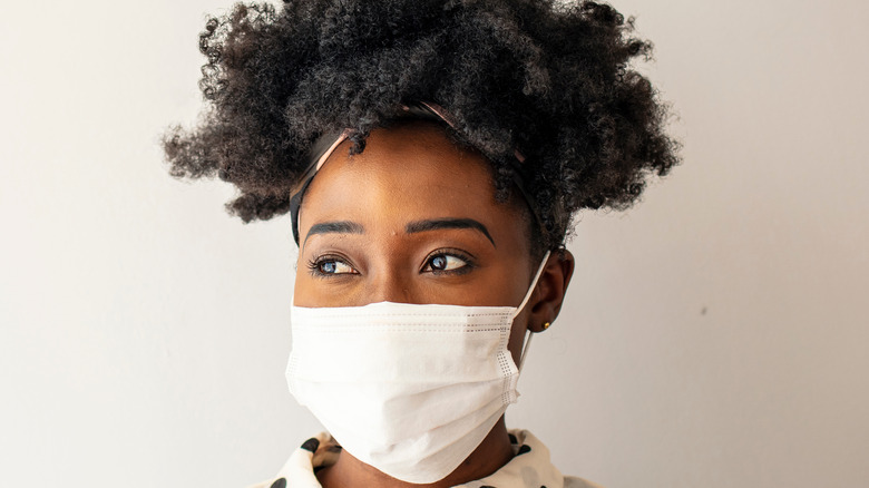 Woman wearing surgical face mask