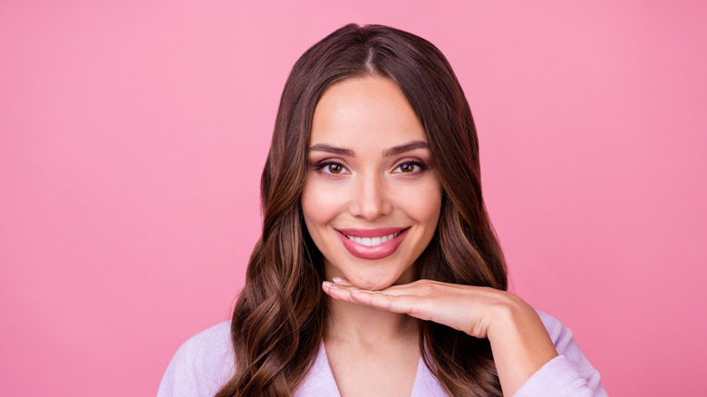 woman pink background jawline