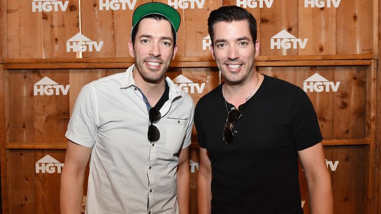 Drew and Jonathan Scott smiling at HGTV event