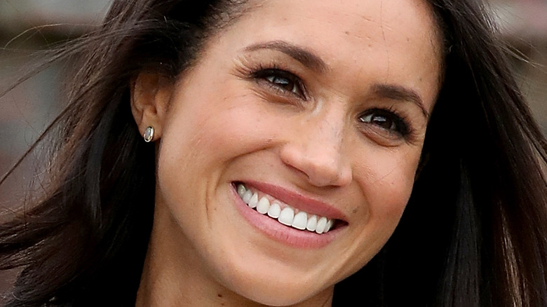 Meghan Markle smiling at an event