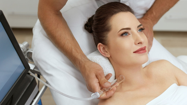 woman getting facial treatment