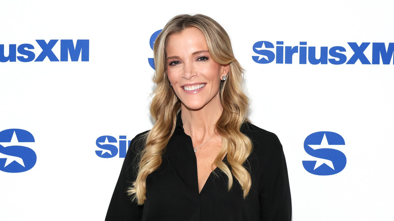 Megyn Kelly smiling with long, curly hair