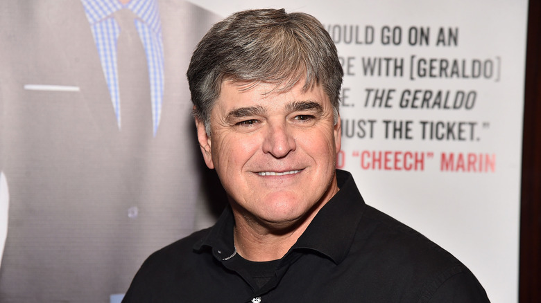 Sean Hannity smiling with cropped brown hair
