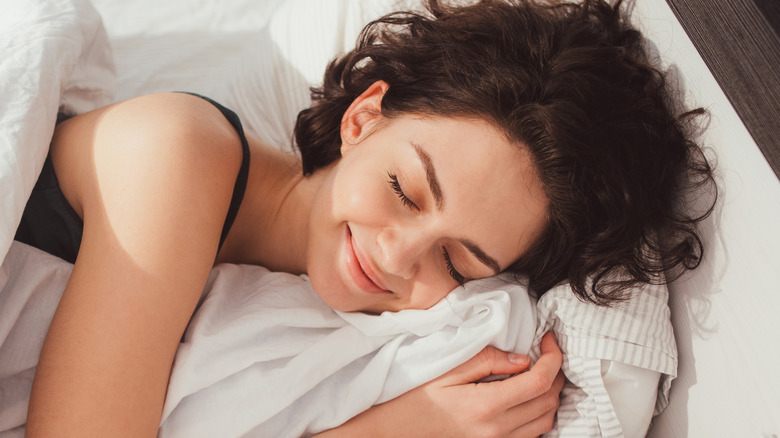 Woman happily sleeping