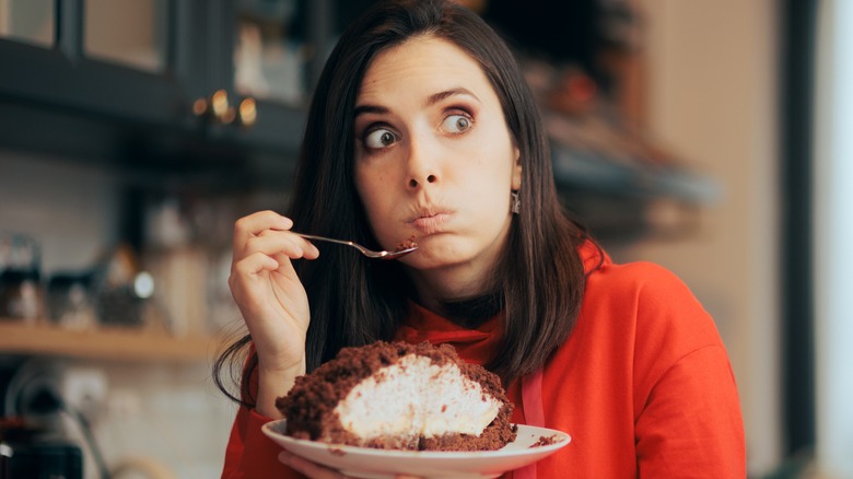 A woman eating cake 