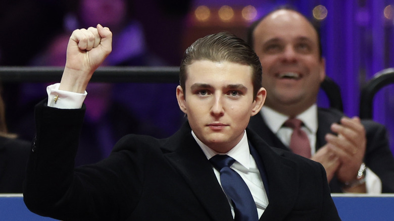 Barron Trump holding up his fist