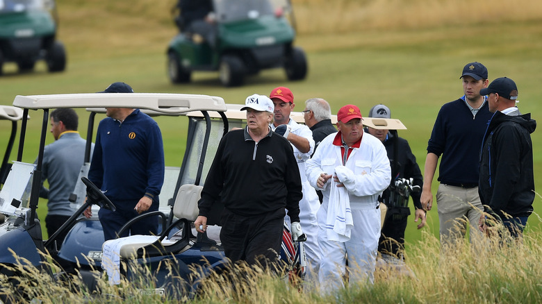 Donald Trump playing golf at Trump Tunberry in Scotland