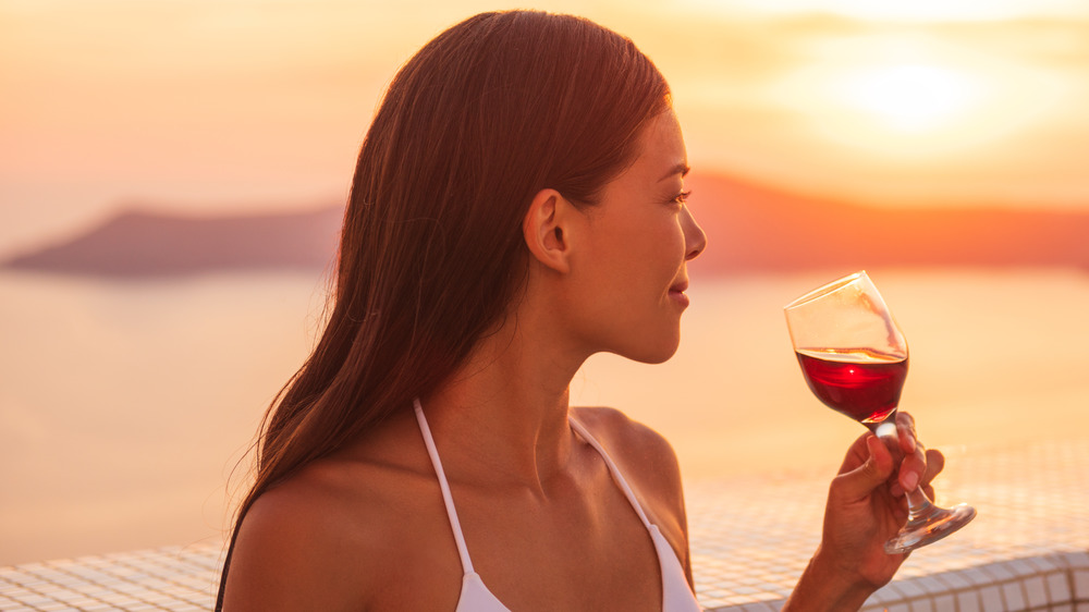 A glass of red wine at the beach
