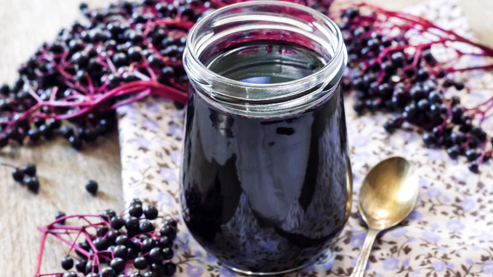 Glass jar of elderberry syrup
