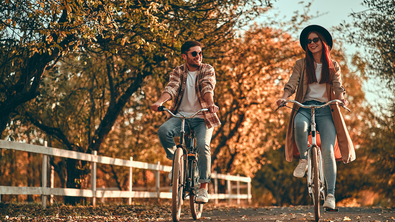 Couple biking in fall