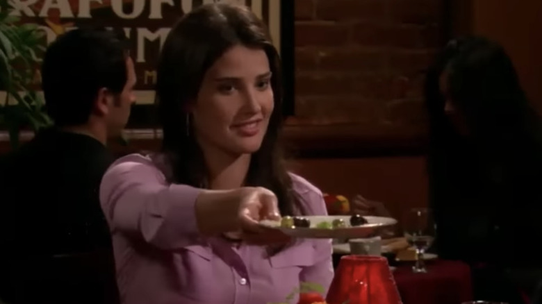 Robin holding a plate of olives on How I Met Your Mother