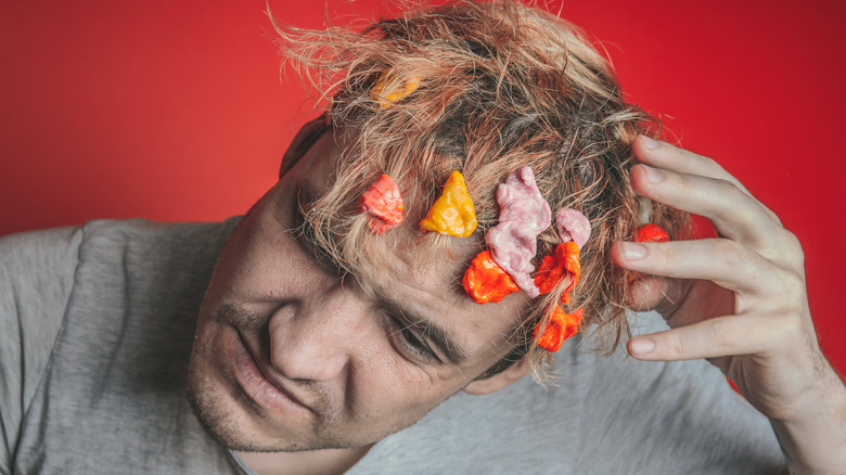 Man with gum in hair