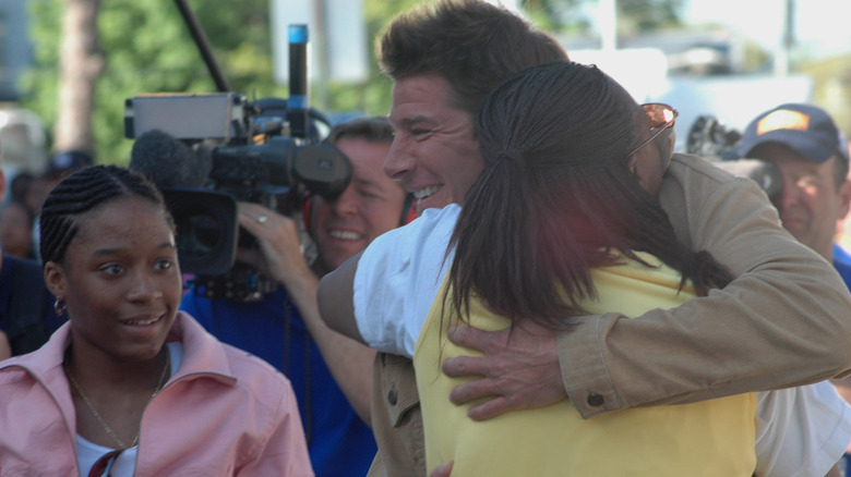 Ty Pennington hugging family for Extreme Makeover