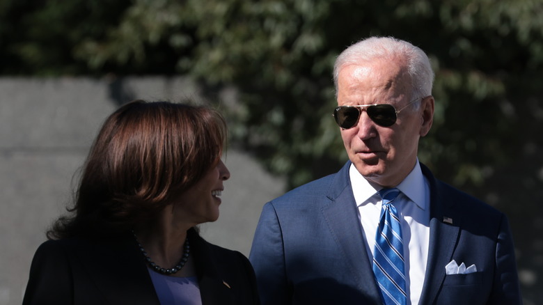 Biden in a blue suit, with Harris in a dark suit