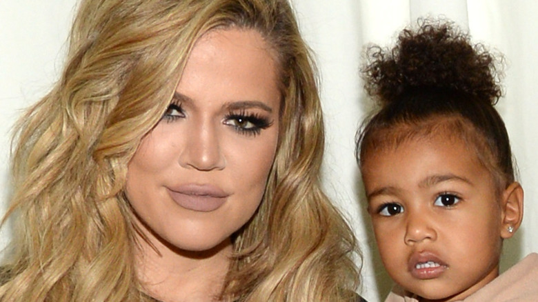 Khloe Kardashian holding daughter, True