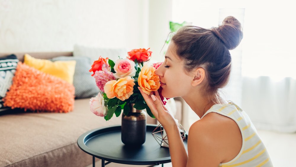 Woman smelling flowers