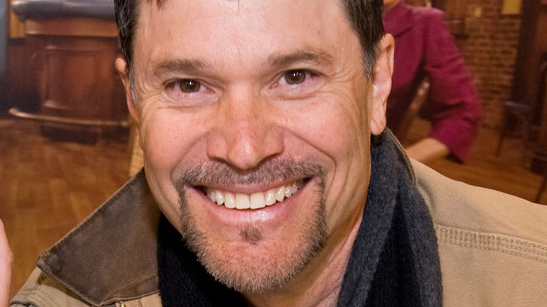 Peter Reckell smiling at an event. 