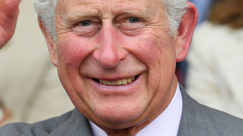 Prince Charles waving with wide smile