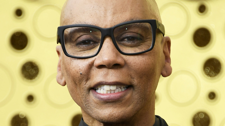 RuPaul Charles smiling on the red carpet