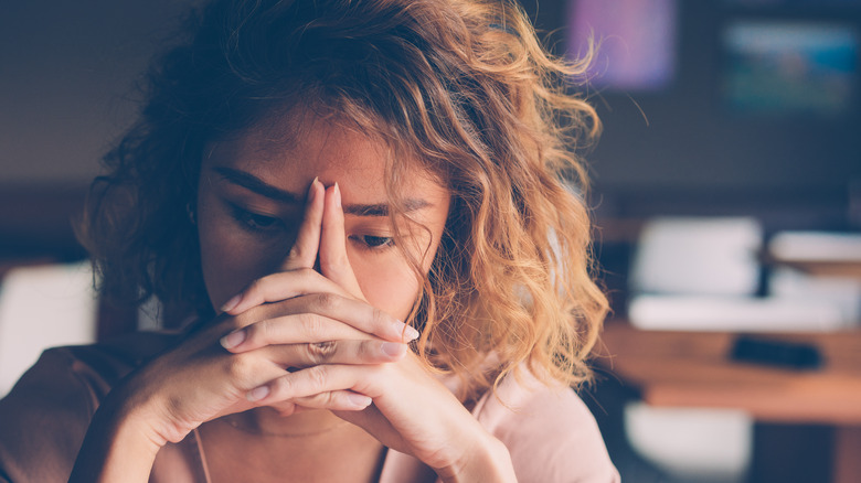 Frustrated woman at her desk