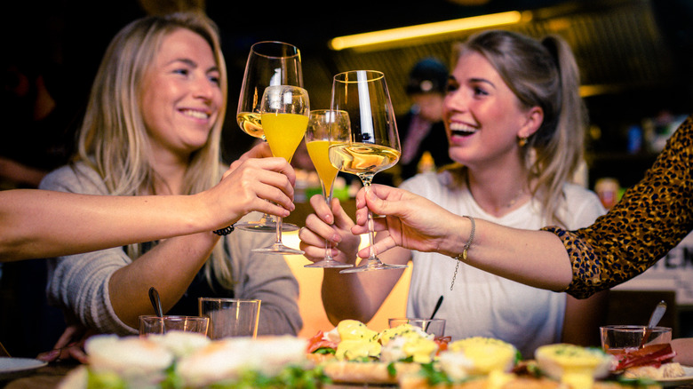 Girls smiling while drinking