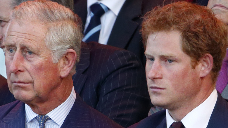 Prince Charles and Prince Harry at an event. 